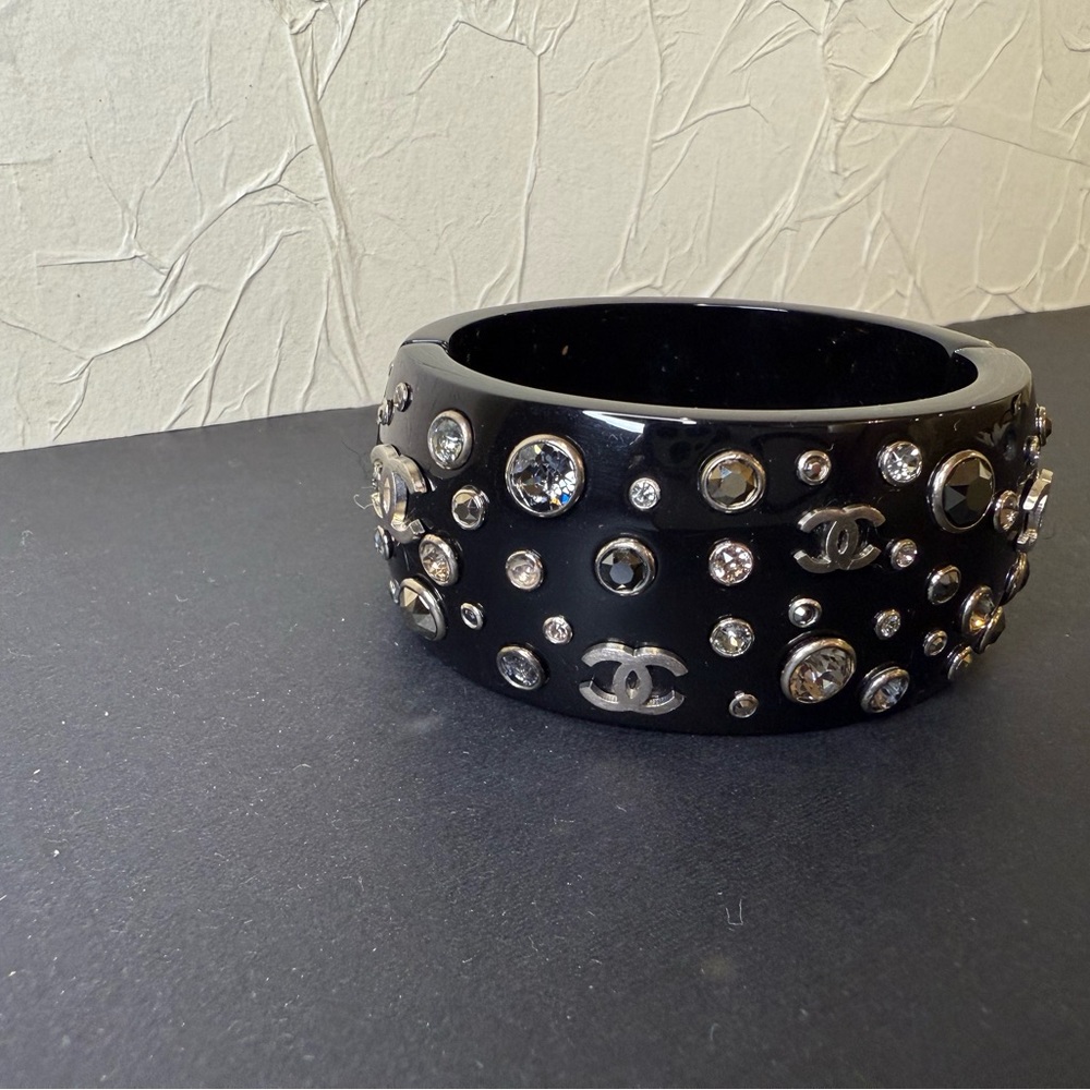 CHANEL Black Bangle with Crystal Accents. One stone missing( shown on photo).